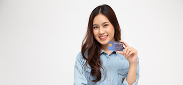 girl smiling and holding credit card