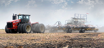 tractor driving through field