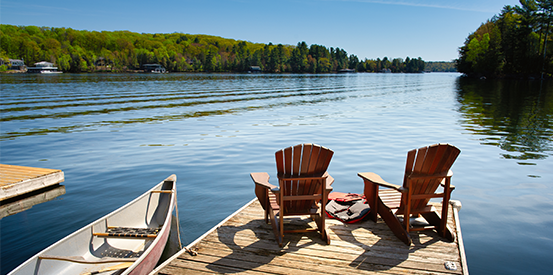 Adirondack chairs overlooking a lake