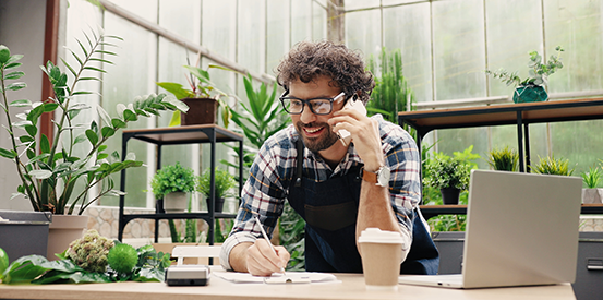 Highlights Layout3 2 Image25 Man talking on the phone in a greenhouse